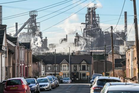 Blast furnaces at the Port Talbot Tata Steel works loom over homes.