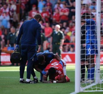 Soccer player Taiwo Awoniyi of Nottingham Forest injured on the field.