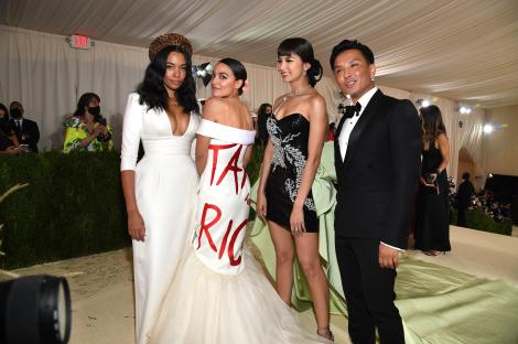 Alexandria Ocasio-Cortez at the Met Gala in a white dress with