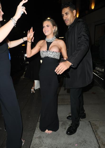 Chloe Burrows goes barefoot during a tipsy exit from the Pride of Britain Awards