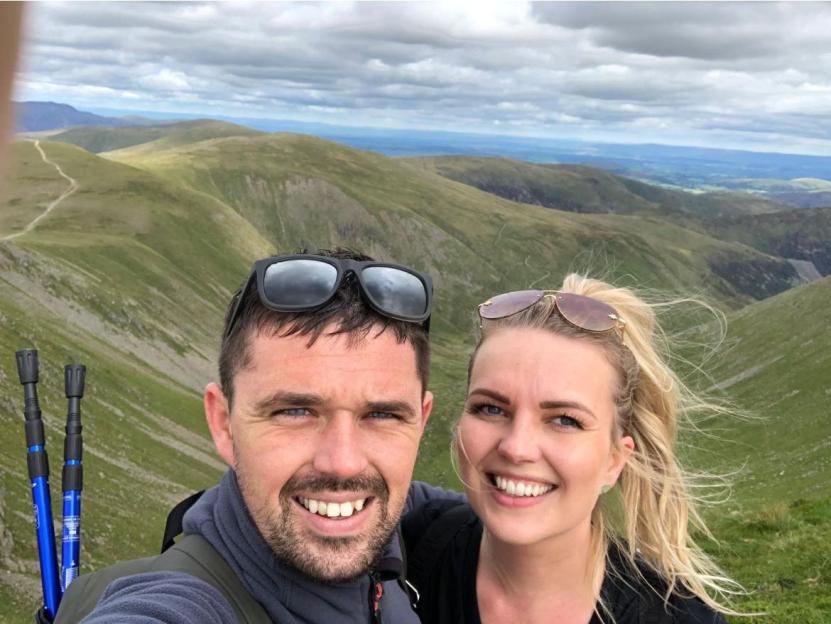 Photo of Craig Jackson and Cherry Turner hiking in the mountains.