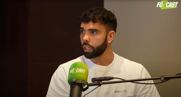 Man speaking into a Fozcast microphone.