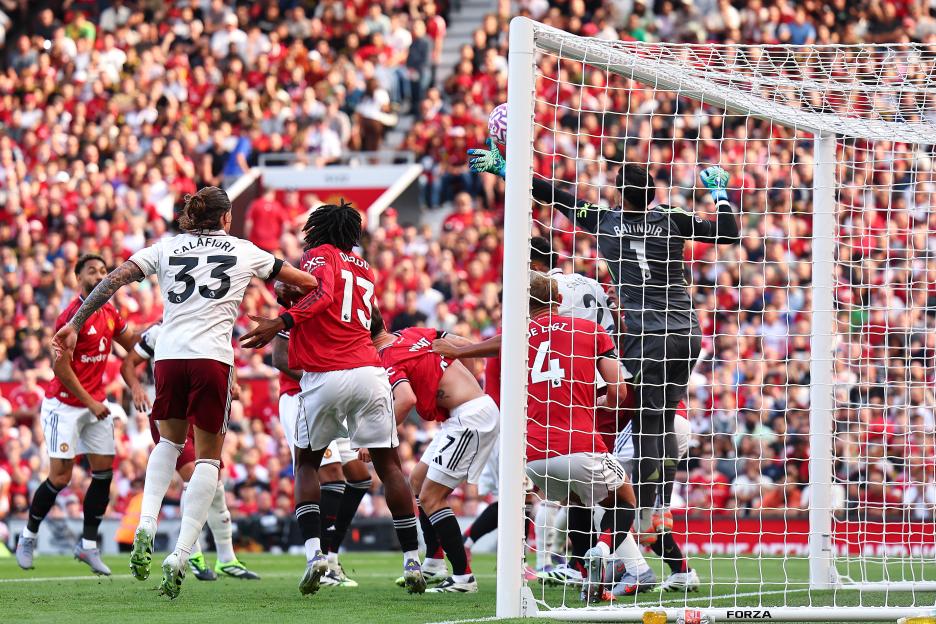 Soccer goalie failing to stop a goal.