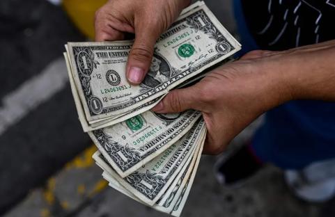 Dollar sinks as Trump’s attacks on Fed chief unsettle traders