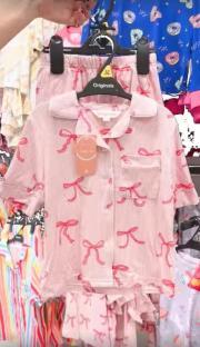Pink pajama set with red bows.