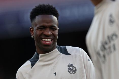 Real Madrid's Brazilian forward #07 Vinicius Junior smiles during a training session at the Emirates stadium in London on April 7, 2025, on the eve of their UEFA Champions League Quarter final first leg football match against Arsenal. (Photo by Adrian Dennis / AFP) (Photo by ADRIAN DENNIS/AFP via Getty Images)