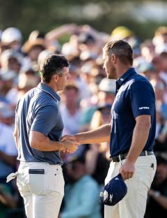 Mandatory Credit: Photo by PETTER ARVIDSON/BILDBYRAN/REX/Shutterstock (15251128hl) Rory McIlroy of Northern Ireland shakes hands with Bryson DeChambeau of the United States on the 18th green during the final round of the 2025 Masters Golf Tournament on April 13, 2025 in Augusta. Golf, The Masters, Final Round, Augusta, United States - 13 Apr 2025