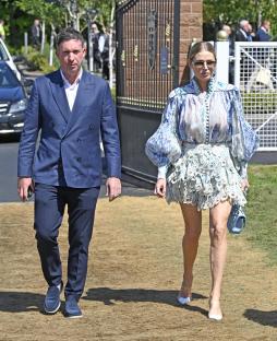 Robbie Fowler and a woman walking at Chester Races Boodles Day.