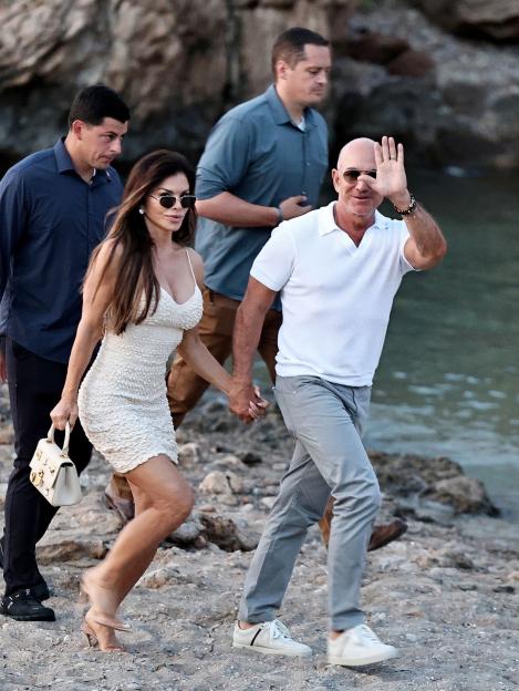 Jeff Bezos and Lauren Sanchez walking hand-in-hand in Ibiza.