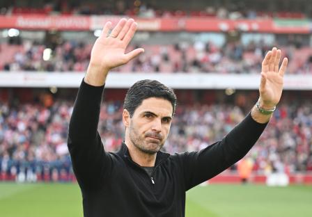 Mikel Arteta, Arsenal manager, acknowledges fans.