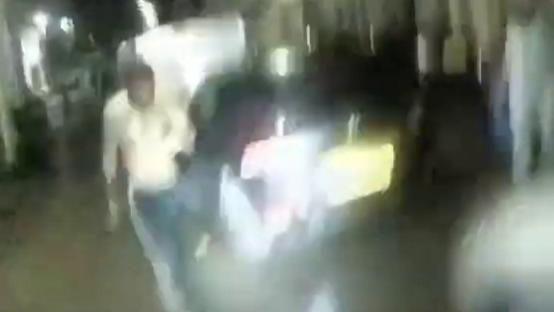 Blurry bodycam footage of a man wielding a knife.