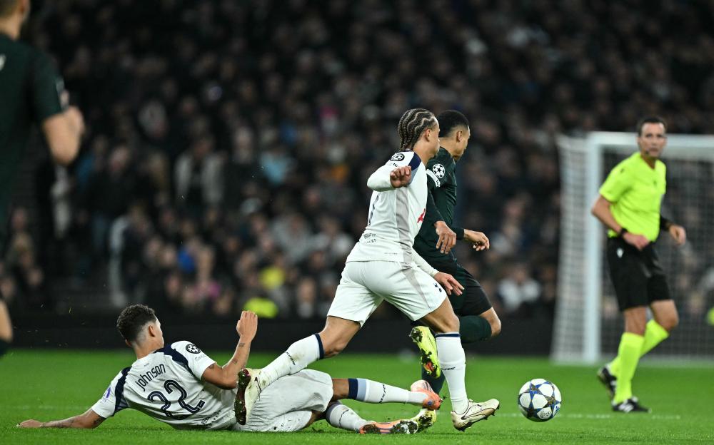 Tottenham's Brennan Johnson Shown Red Card for Reckless Tackle Against FC Copenhagen, Conceals Face in Embarrassment