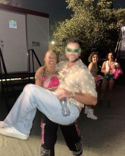 Chris Hughes being carried by JoJo Siwa after her concert.
