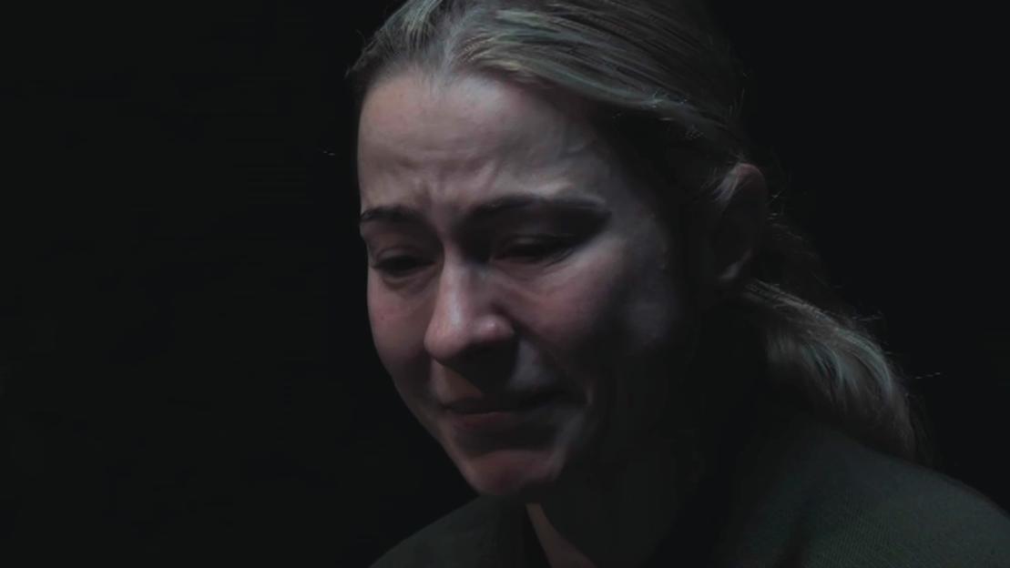 Close-up of a woman crying.