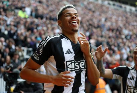 Newcastle United's William Osula celebrates scoring a goal.