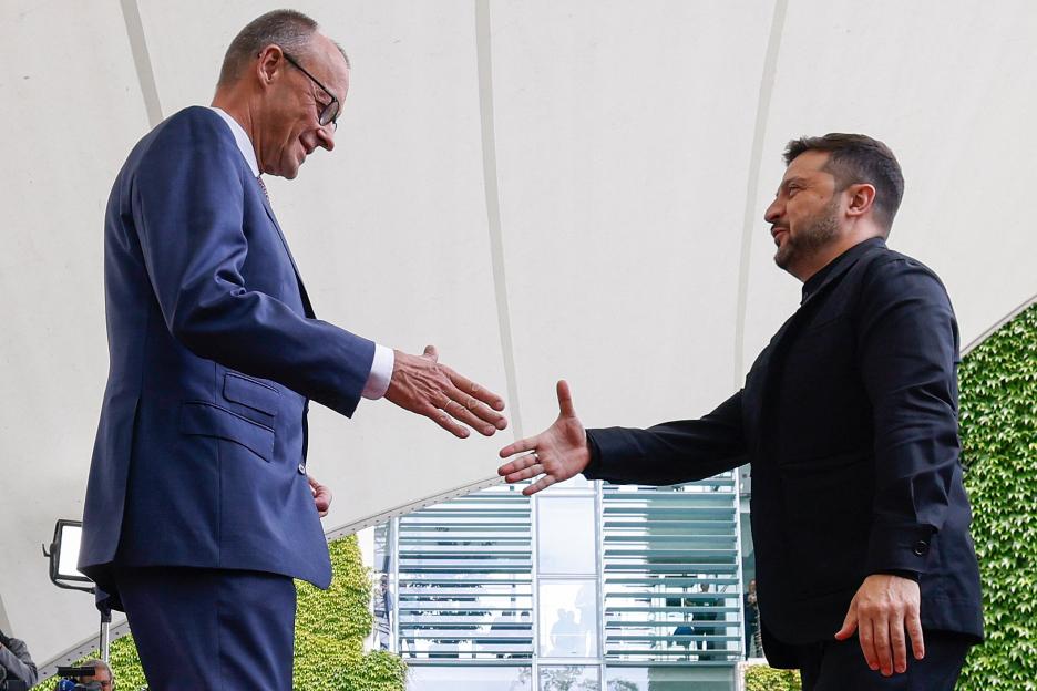 Friedrich Merz and Volodymyr Zelensky shaking hands.