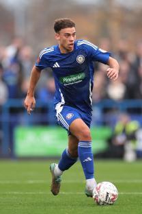 Isaac Sinclair of Curzon Ashton in action during an FA Cup match.