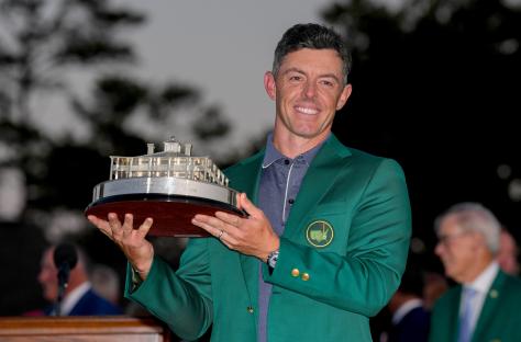 Rory McIlroy holding the Masters Championship trophy.