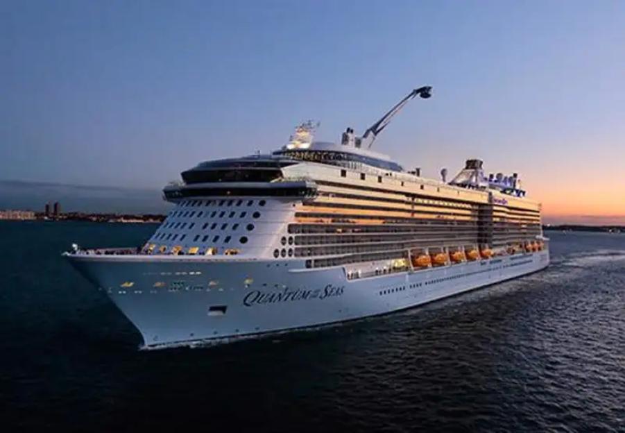 Cruise ship Quantum of the Seas sailing on water.