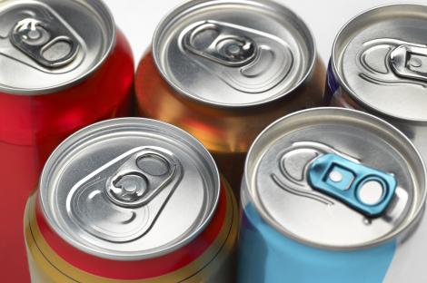 Close-up of several soda cans.