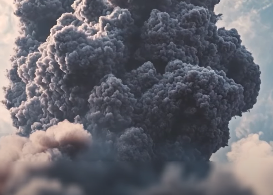 Large plume of dark smoke erupting.