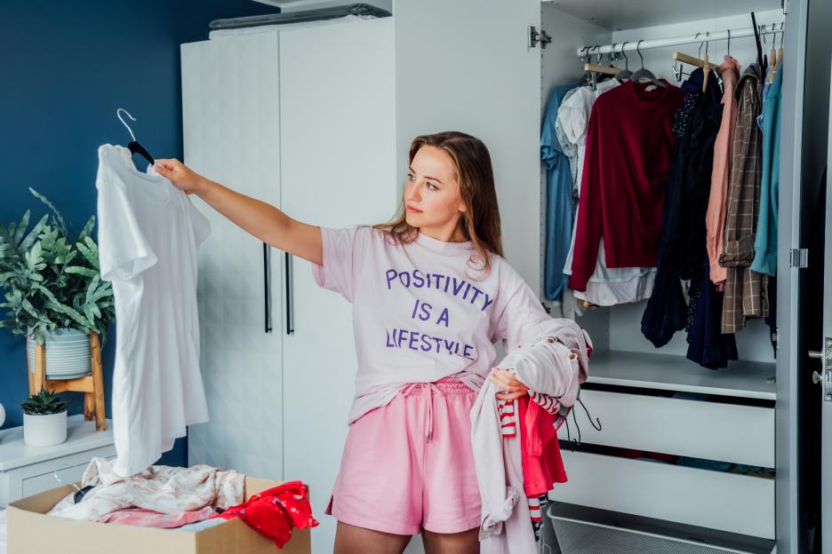 Woman donating clothes.