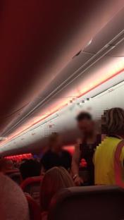 Airplane passengers seated in their seats.