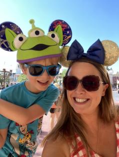 Woman and child at Disneyland wearing character ears.