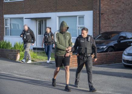 Dramatic moment cops smash ruthless county lines gang forcing kids to smuggle fatal amounts of drugs in their bodies