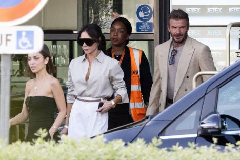 The Beckham family arriving at an airport.
