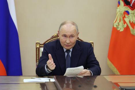 Vladimir Putin at a meeting announcing a successful missile test.