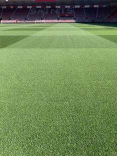 Southampton's football pitch with stands in the background.