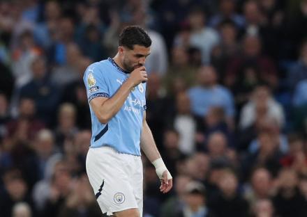Mateo Kovacic of Manchester City leaves the pitch after receiving a red card.