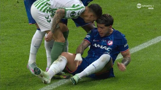 Soccer player receiving medical attention on the field.