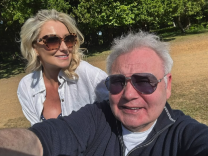 Selfie of a man and woman outdoors.