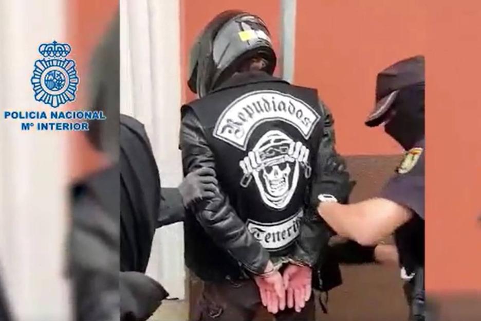 Hells Angels member in handcuffs.