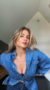 Woman in denim shirt.