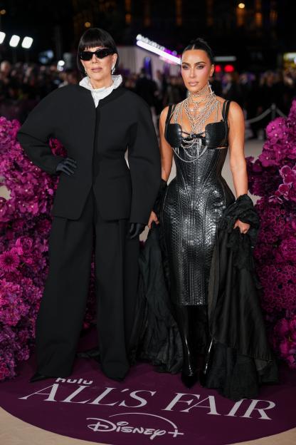 Kris Jenner and Kim Kardashian pose for photographers at the "All's Fair" TV series premiere in London.