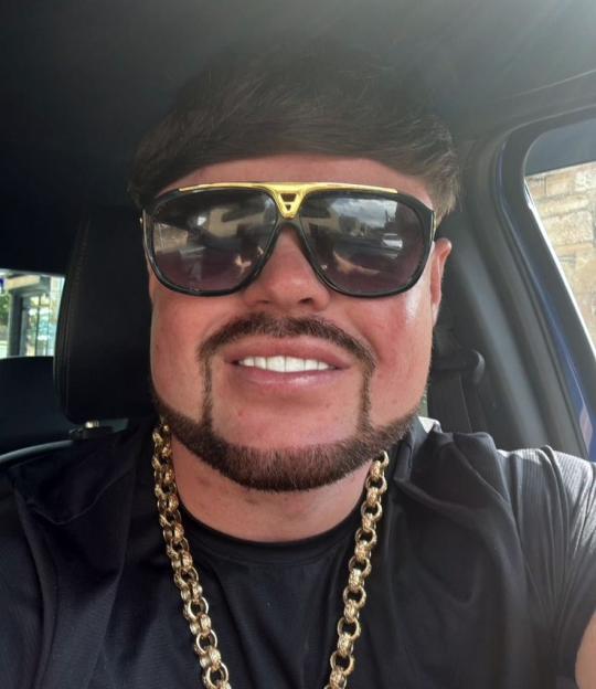 Close-up photo of Jack Kay, the "Ibiza Final Boss," wearing sunglasses and a gold chain.