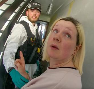 Bodycam footage of a police officer arresting a woman suspected of murdering her parents.