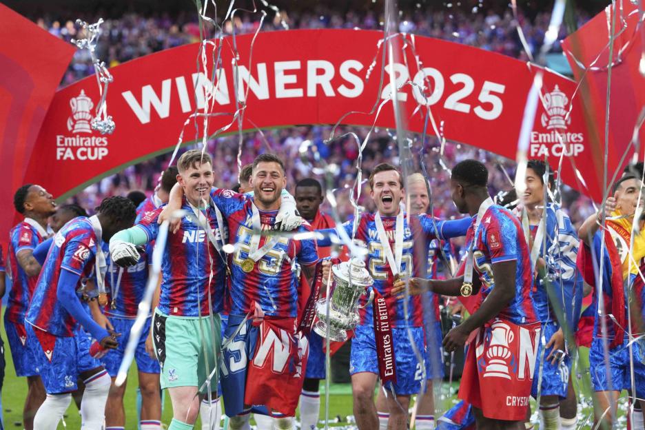 FILE - Crystal Palace players celebrate with the trophy after winning the English FA Cup final soccer match between Crystal Palace and Manchester City at Wembley stadium in London, May 17, 2025. (AP Photo/Kirsty Wigglesworth, File)
