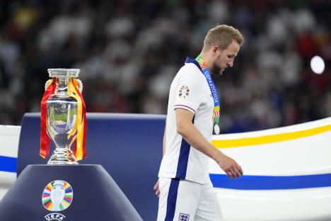 FILE - England's Harry Kane walks past the trophy after the final match between Spain and England at the Euro 2024 soccer tournament in Berlin, Germany, Sunday, July 14, 2024. (AP Photo/Manu Fernandez, file)