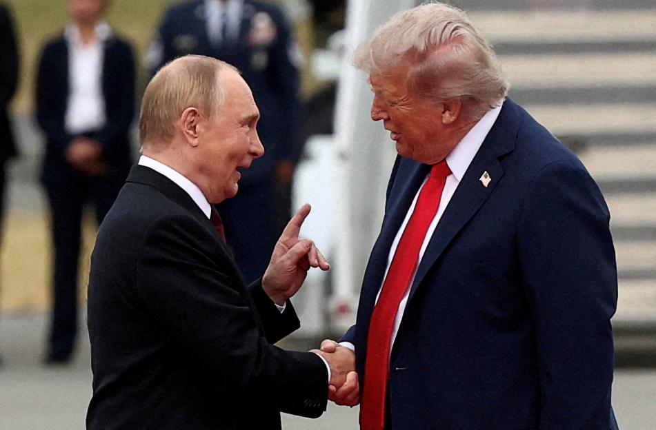 Russian President Vladimir Putin shakes hands with U.S. President Donald Trump while pointing a finger at him.