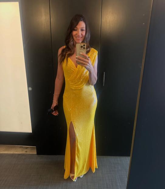 Alison Bender, Sky Sports News presenter, in a yellow sequined gown.