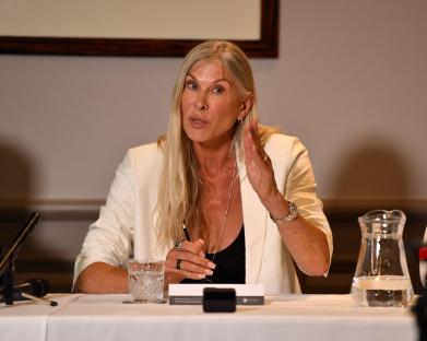 Sharron Davies MBE speaking at a press conference.