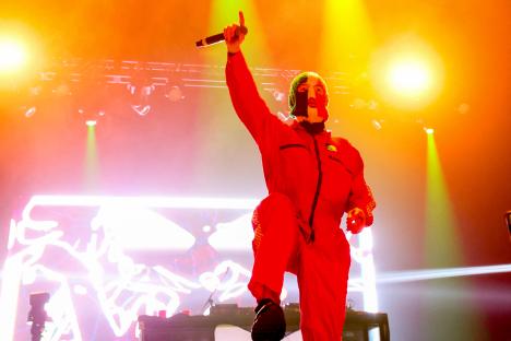 DJ Provai of Kneecap performing onstage.
