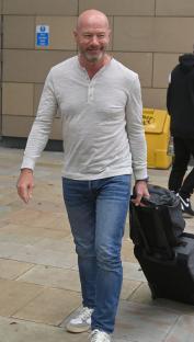 Micah Richards arriving with luggage.