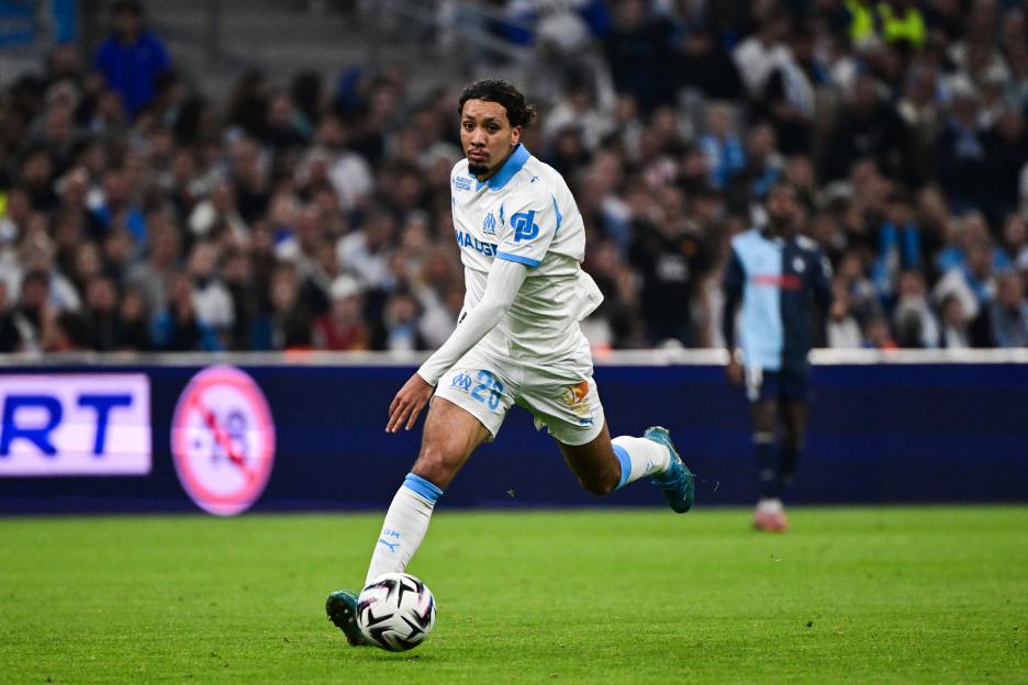French midfielder Bilal Nadir of Olympique de Marseille runs with the ball during a football match.