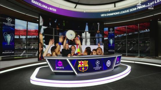 UEFA Champions League semi-final studio set with Barcelona players celebrating.