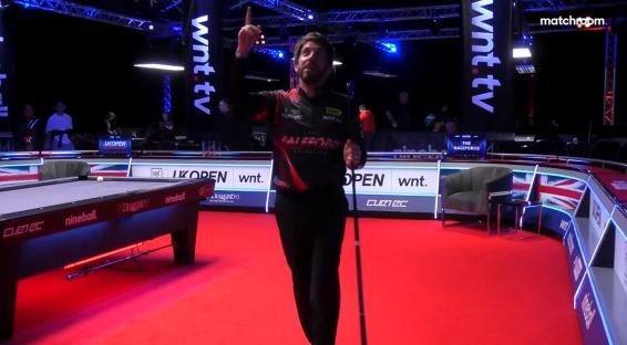 A pool player celebrating a shot.